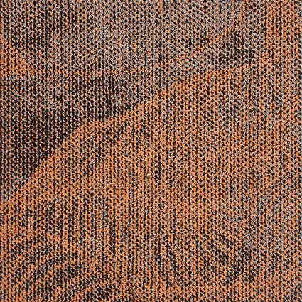 Close-up of broadloom carpet with a swirling textured pattern in copper and grey