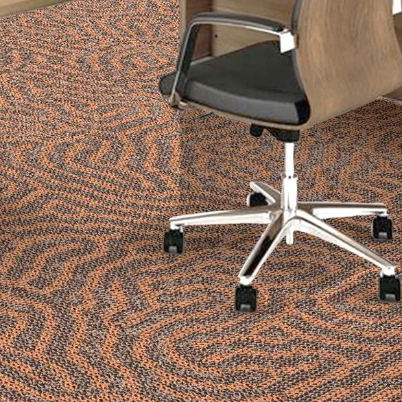 Office chair with a black seat on a broadloom carpet with a copper and grey zigzag pattern