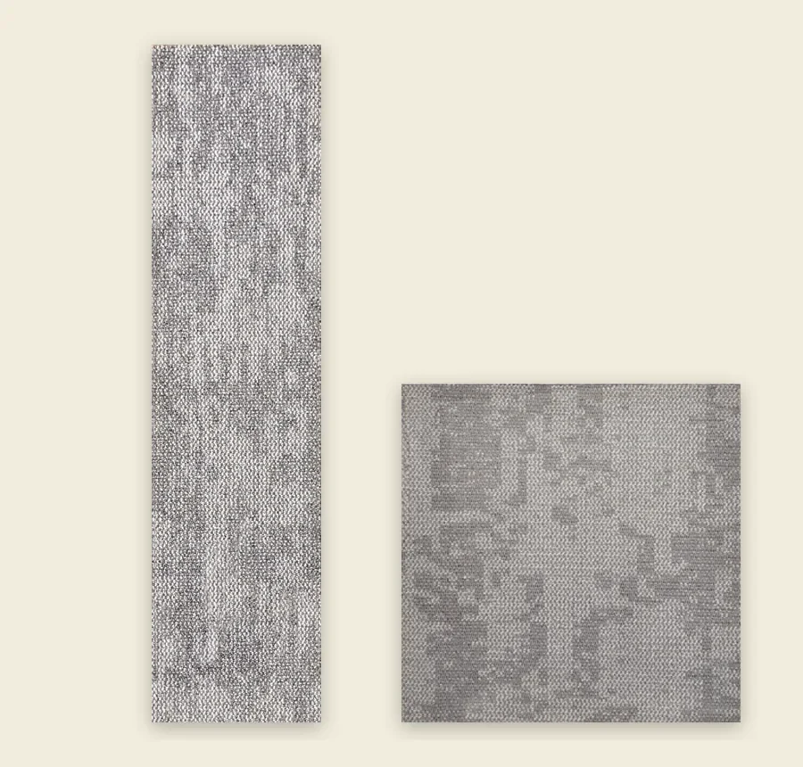 A long grey carpet plank beside a square light grey carpet tile at the same scale on a cream background