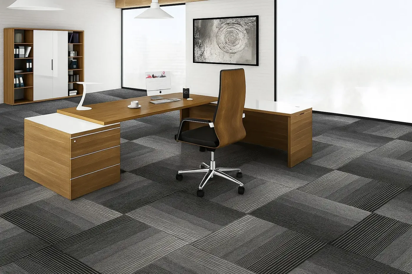 Office cabin with a timber desk, a high-backed timber office chair with a black seat and bookshelves on a floor of grey carpet tiles laid in alternating tones