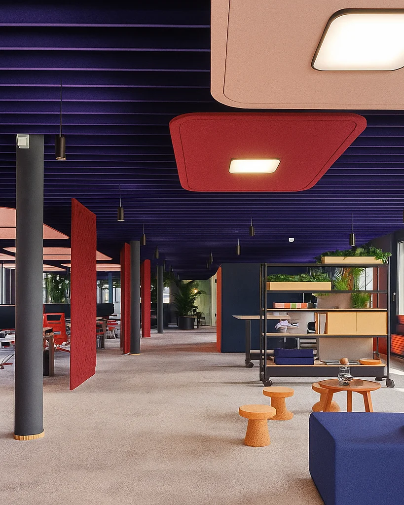 Open-plan office with rows of purple ceiling baffles, suspended red and pink ceiling clouds with built-in lights, free-standing red felt screens and cork stools